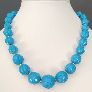 Blue beaded necklace with gold accents